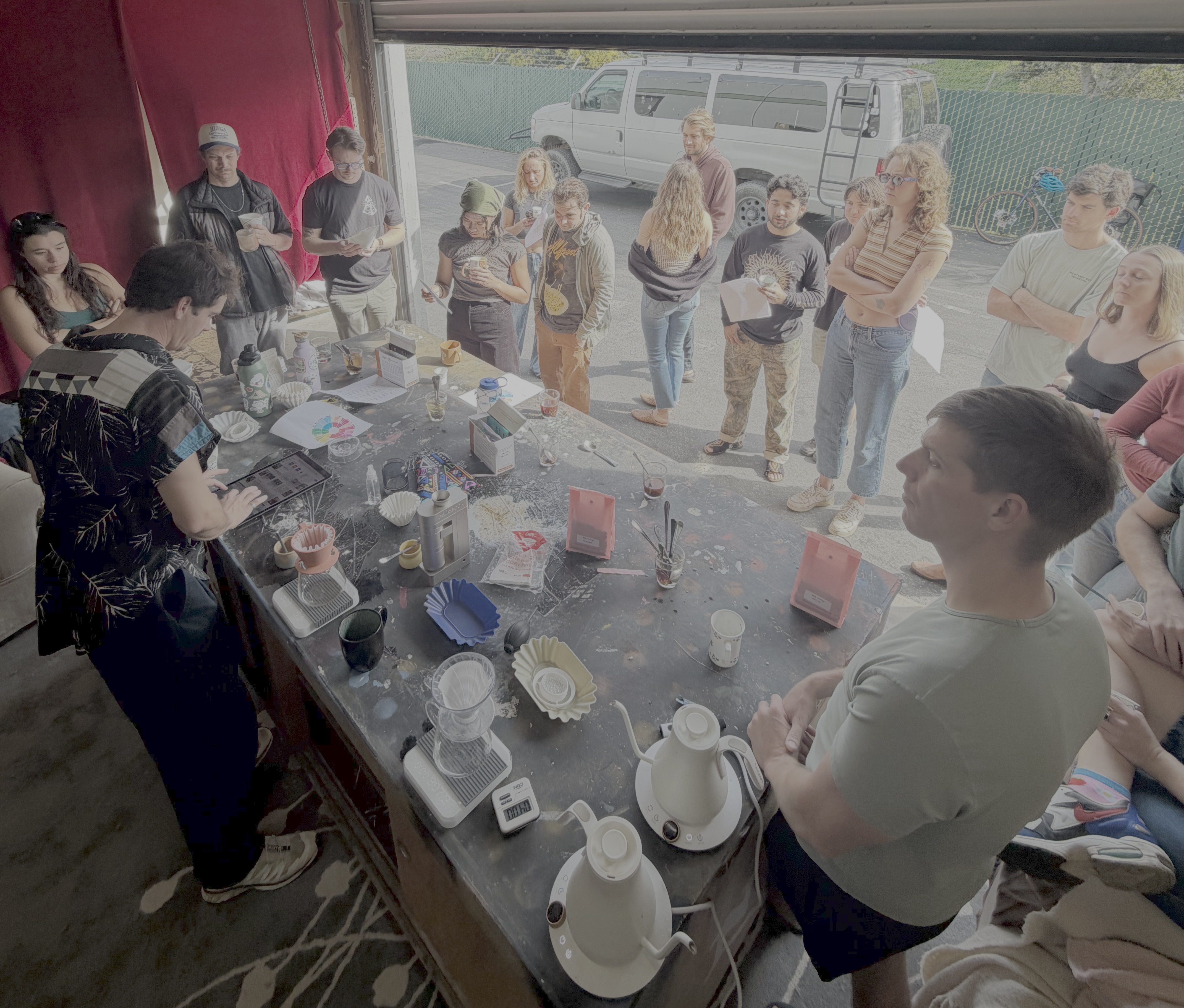A group gathered around a brew-class table