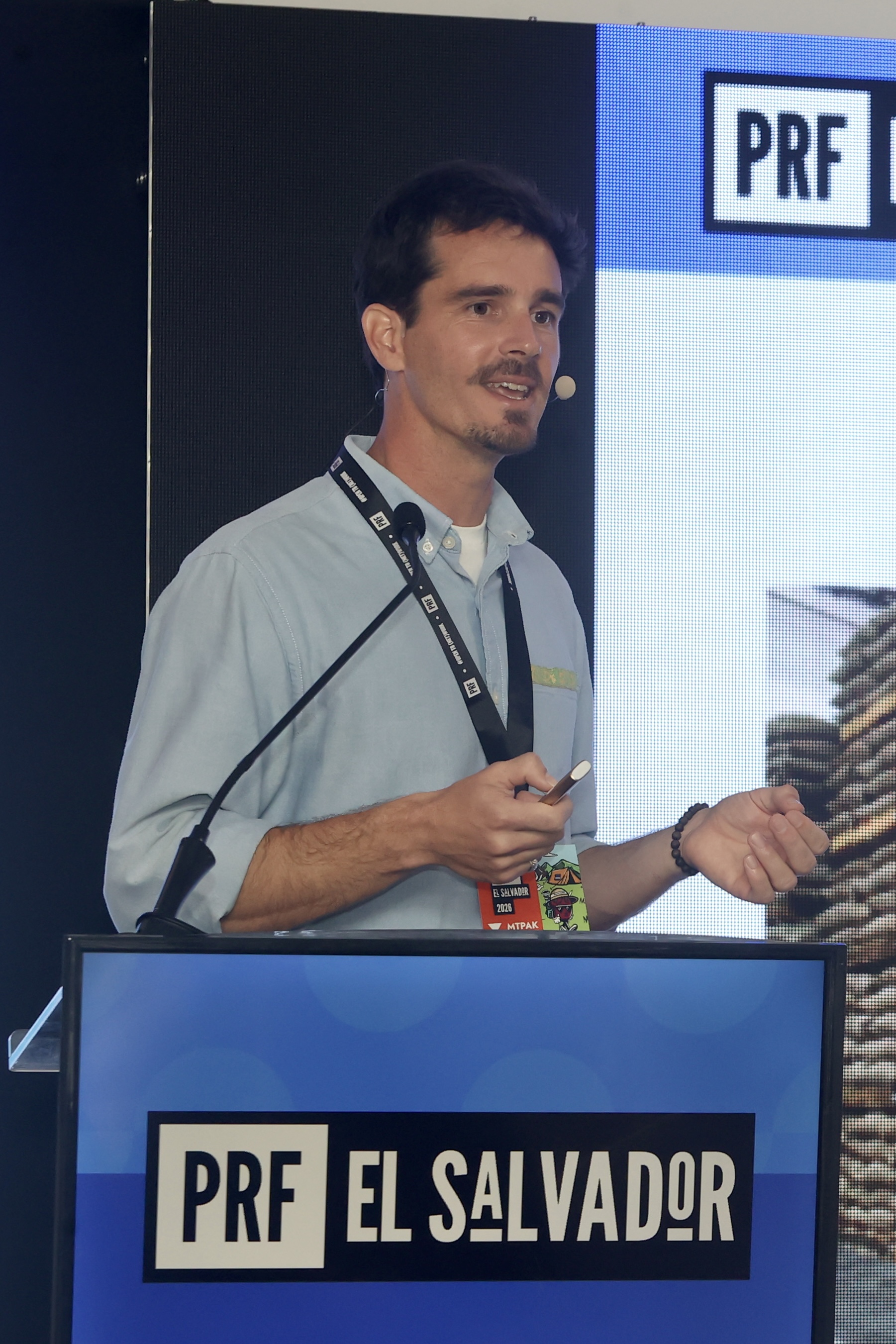 Griffin speaking on stage at PRF El Salvador
